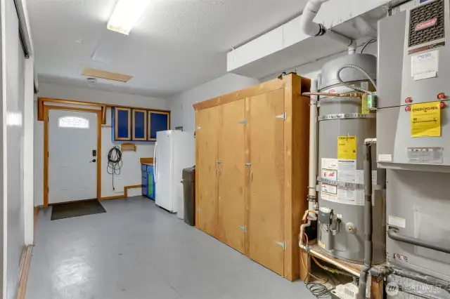 Storage Storage and more storage. Wood cabinets house the water treatment system, replaced in (2020) More storage in sliding doors on left,