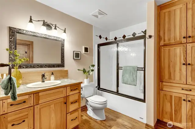 2nd floor full bathroom with lots of storage and beautiful cabinets and flooring. Located at the top of the stairs first door on the left.