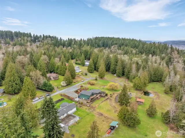 How about your own pond detached shop and wrap around trex deck to enjoy nature as well as the stunning Mt. Rainier view.