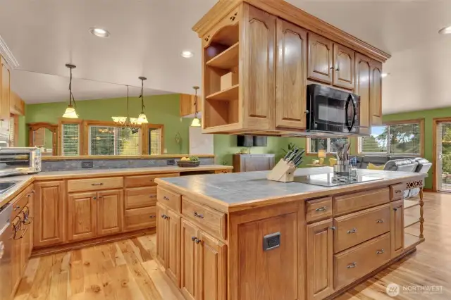 The kitchen is an entertainer and chef's delight. The center island is massive over 9-ft X 4+ ft. The cabinets have the rolling drawers and the large drawers are perfect for storage.