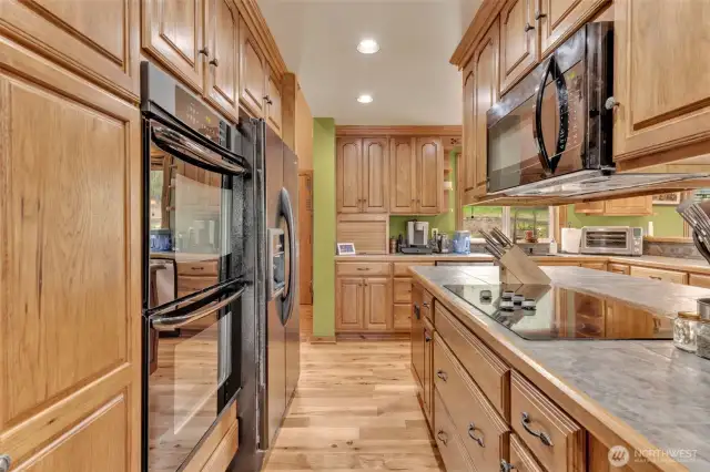 Double ovens, ceramic cooktop and microwave all situated perfectly in the well laid out kitchen.