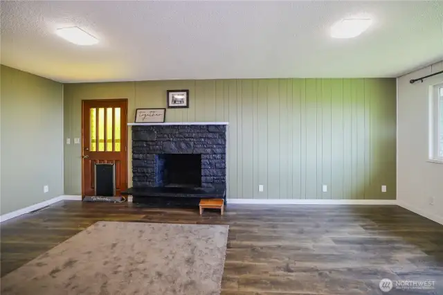 Family room right off kitchen, with a cozy fireplace for those chilly nights.