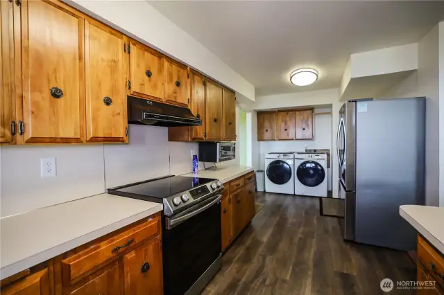 Very nicely equipped kitchen, stainless steal refrigerator, and laundry close by.