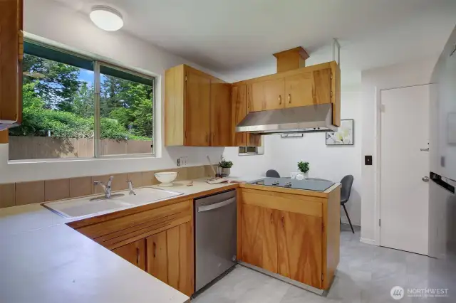 Gorgeous combination of original mid-century wood and modern stainless appliances. The fresh new flooring brings it all together!