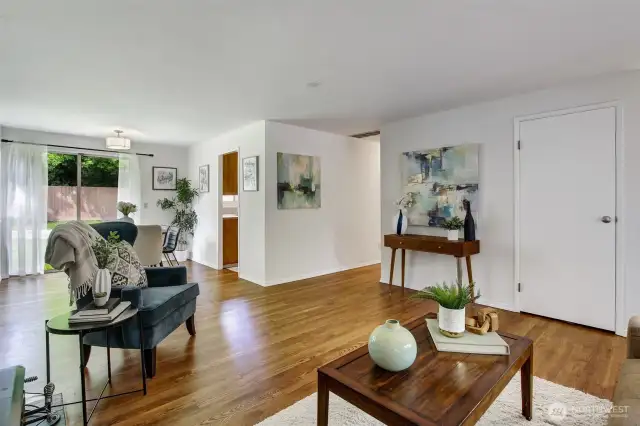 All three bedrooms are down the hall to the Right...Dining room is straight ahead, and the kitchen is open to the dining room. Easy access to the yard creates flow that's excellent for entertaining!