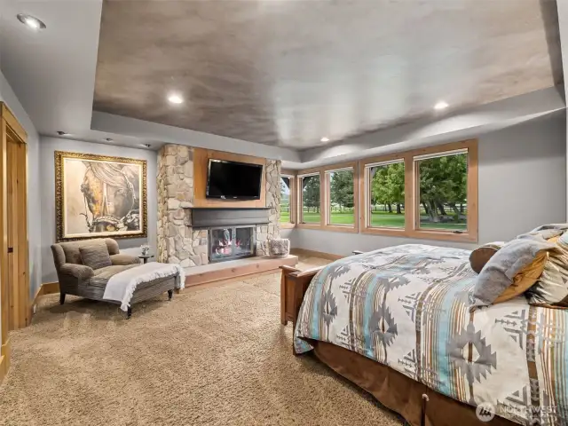 Private and serene primary bedroom with gas fireplace. You can see the fabulous closet in the 3D tour and on the website.