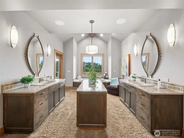 Primary bathroom has his and hers private toilet rooms, heated floors, and a personal patio
