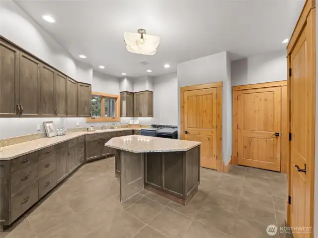 Giant laundry room with a built-in, walk-in cooler and 2 closets