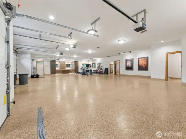 2,909 sq ft finished garage. Includes a large closet, a kennel for your dogs with auto-fill water bowls, hose hook-up for easy clean ups, a half bathroom, built-in cabinetry and an office or storage room.