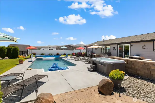 Back of home with huge entertaining patio.