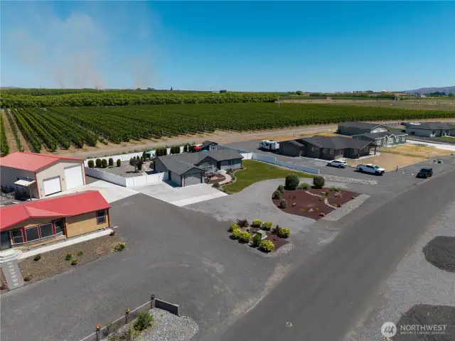 Aerial view of home backing up to orchards.