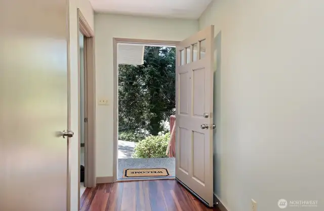 Welcome to the main part of your home. Flex room is located through the open door to your left. Behind you is the hallway to the garage, the 2nd Primary & the Kitchen.