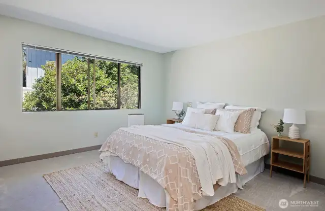 2nd Primary bedroom with Full Bath and Standard sized closet. Window looks out upon the backyard.