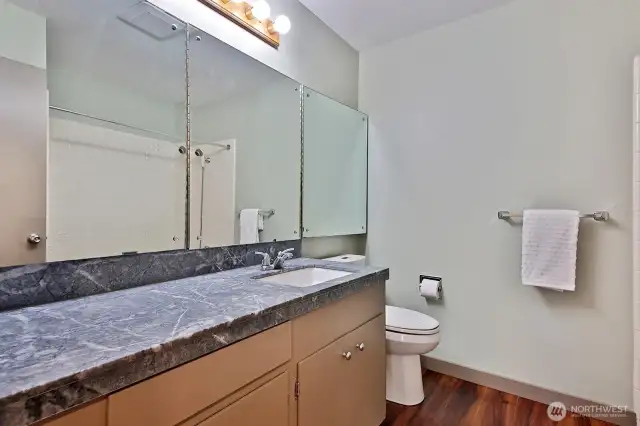 Full Guest Bath off of hallway between Entry and Kitchen.
