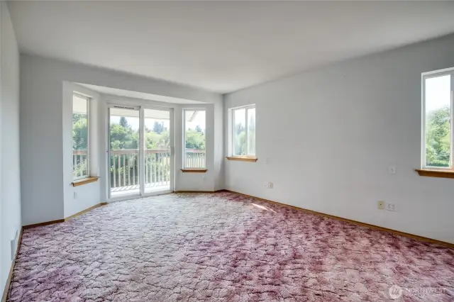 Primary bedroom with slider to the upper deck