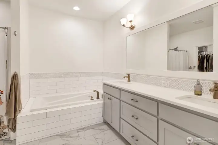 We love the marble-style tile—it adds timeless elegance and a luxurious feel to the space.