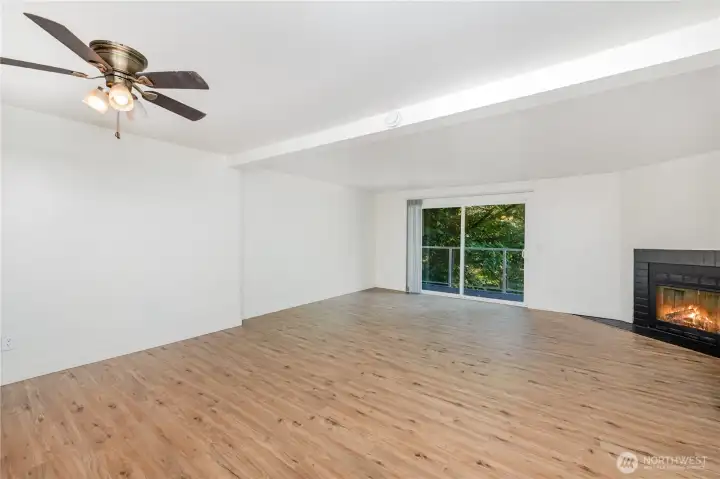 Living and dining area seamlessly flow together with private balcony just off the living room.