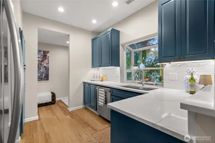New Quartz countertops, lots of space for meal prep.