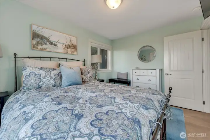 Bedroom with deck and access to hot tub on the main floor.