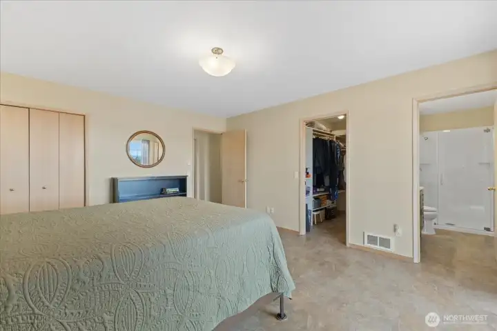 Another shot of the Primary, showing the walk-in-closet & bathroom.