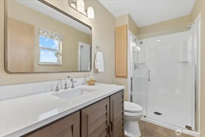 Primary Bathroom w/ walk-in-shower.