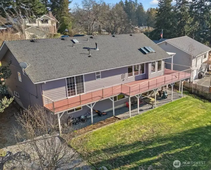 Aerial shot of the back of the home & yard.