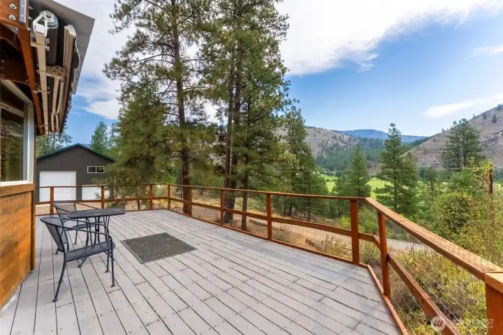 Imagine morning coffee on this sunny deck overlooking the Chewuch River valley.