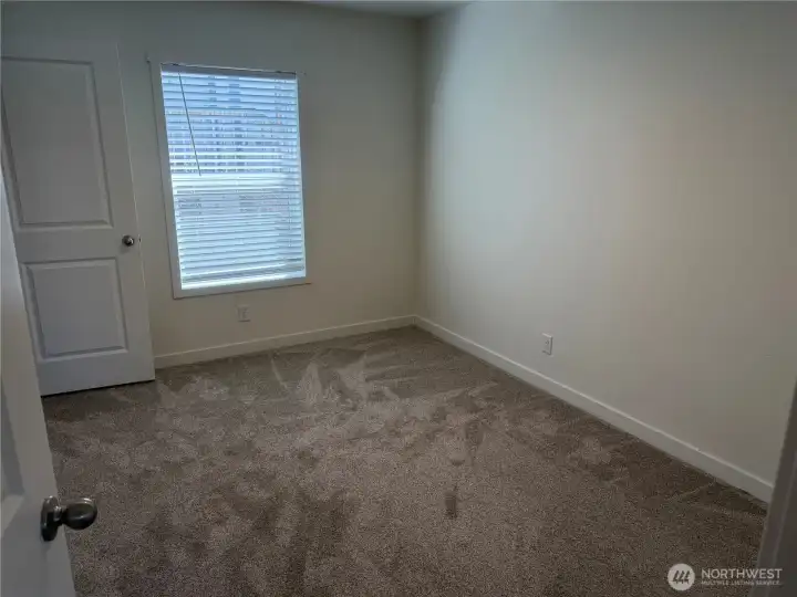 Bedroom 3. NOTE: Picture is of a different home w/same floor plan so colors may be different.