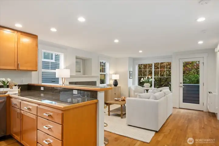 The kitchen opens seamlessly to the living area, creating a bright and connected space for daily life and entertaining.