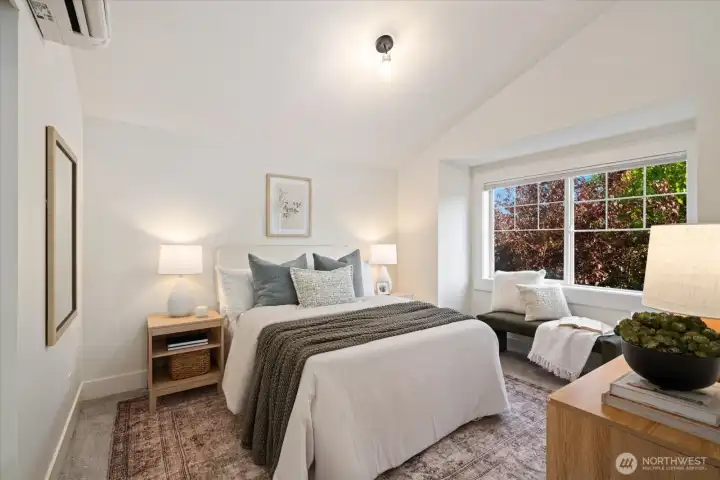 The peaceful primary suite offers vaulted ceilings, tranquil treetop outlooks, and a true sense of retreat. Checkout winter views of Mt. Rainier, a nice bonus!