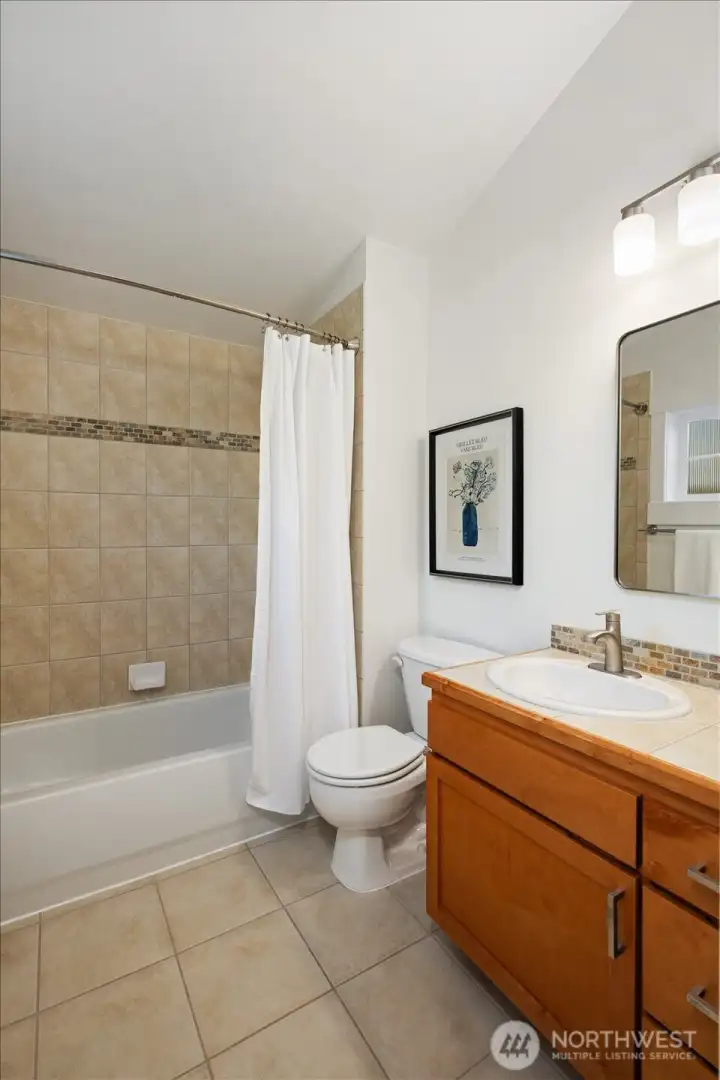 Thoughtfully designed, the en suite bath offers timeless finishes and a full bath layout for effortless daily living.
