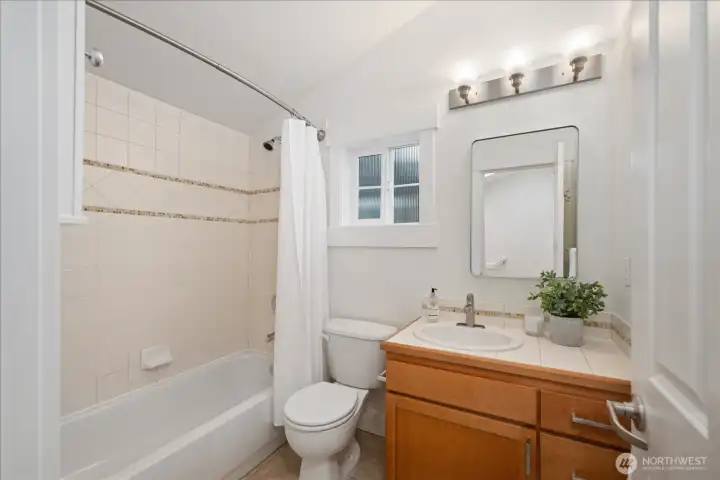 Conveniently located near the secondary bedroom, the guest bath features timeless finishes and a full tub and shower combination.
