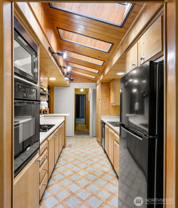 Functional kitchen with breakfast bar and plenty of cabinets. Be sure to check out the pantry's unique design that offers hidden storage! Functional kitchen with breakfast bar and plenty of cabinets. Be sure to check out the pantry's unique design that offers hidden storage!
