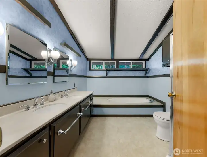 Soaking tub, separate shower and dual vanities in the attached primary bath. Soaking tub, separate shower and dual vanities in the attached primary bath.