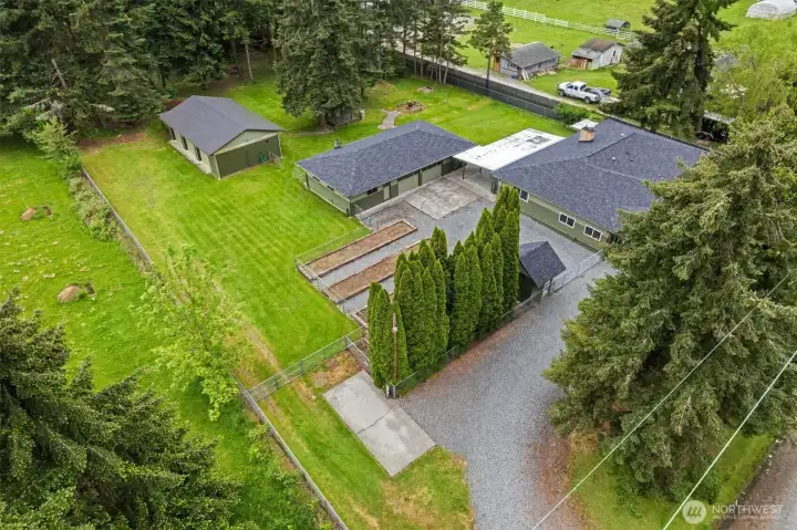 A 30-year architectural roof was installed on the house and 2 car garage in May 2025. The roof on the 3 car garage was replaced 4 years ago with 30 year 3tab asphalt shingles.