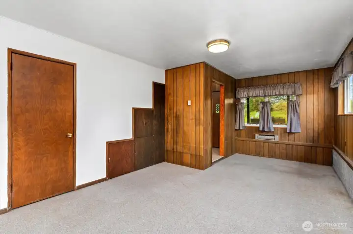Lots of built in storage. Access the crawl space behind the door on the left.
