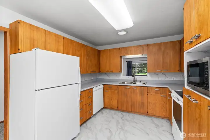 Cabinet grade plywood cabinets and new flooring in the kitchen.