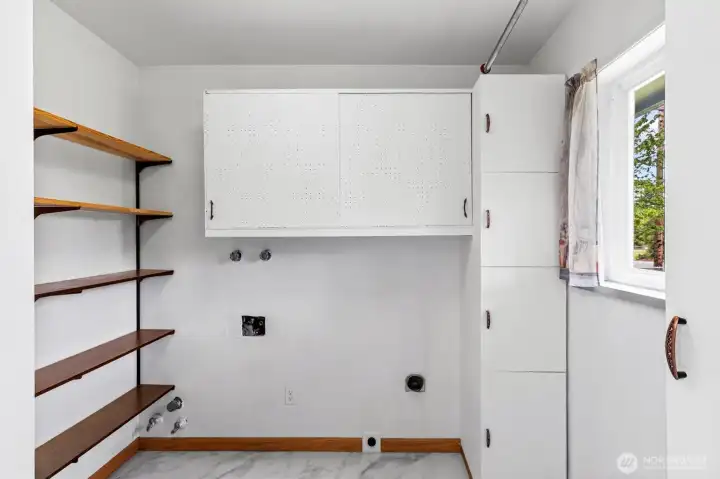 Large utility room with lots of built-in storage.