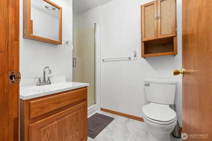 3/4 bath with new faucet and new flooring.