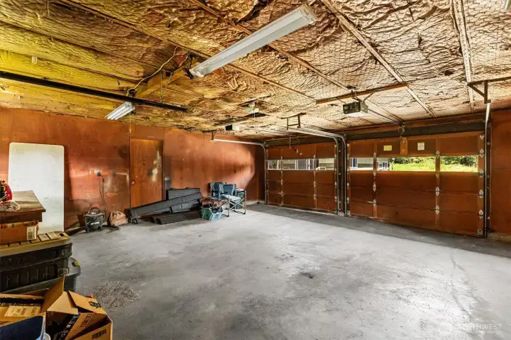 The two car garage has automatic door openers and plenty of space for all your hobbies. Not pictured is the 3rd garage door that opens to the backyard.