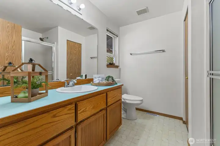 Primary bathroom with linen closet.