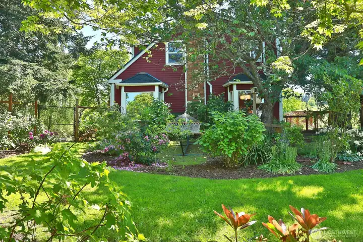 Your own private sanctuary, a short stroll to Langley's seaside village. Sale includes the adjacent vacant lot for continued garden enjoyment or future development.