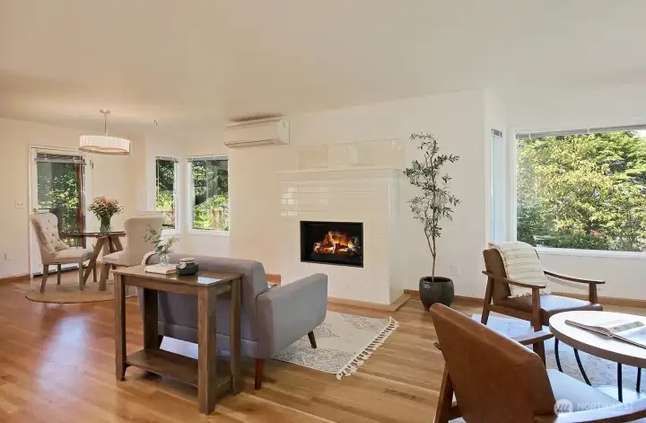 Updates during ownership include a new roof, interior paint, new windows, ductless mini-splits throughout, removal of the previous free-standing stove and the addition of the new propane fireplace and mantel. A small half wall was also removed, opening the living/dining space.