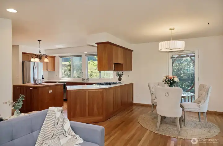 Newer stainless appliances, including a propane cooktop and double oven. Kitchen windows have been replaced since these photos were taken.