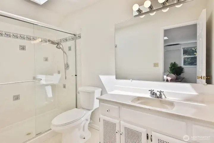 Generous shower and a skylight to bring in the light!
