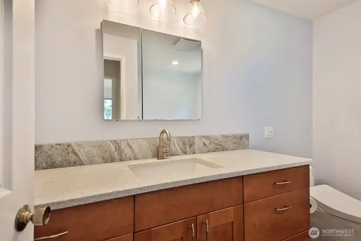 This updated bathroom is along the west side of your home and is located near Bedrooms #3 and #4.
