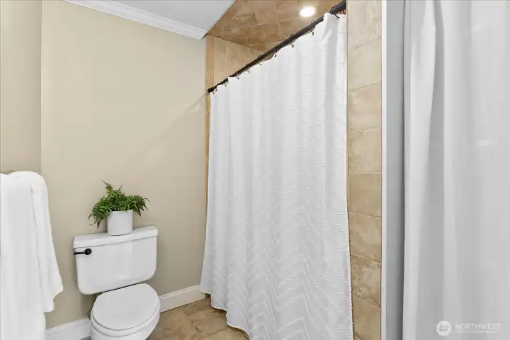 Enjoy added privacy with a separate toilet room and spacious walk-in shower.