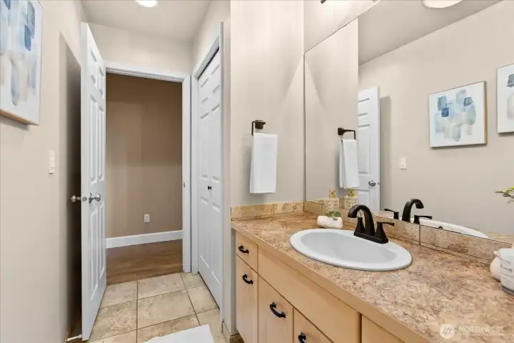 Designed for busy mornings, the shower and toilet area in the upstairs bathroom are tucked behind a separate door.
