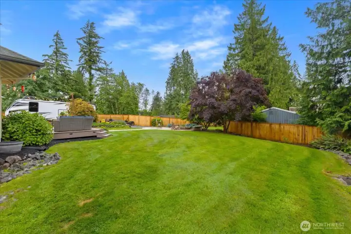 Nearly ¾ acre of fully fenced outdoor living and recreation space.