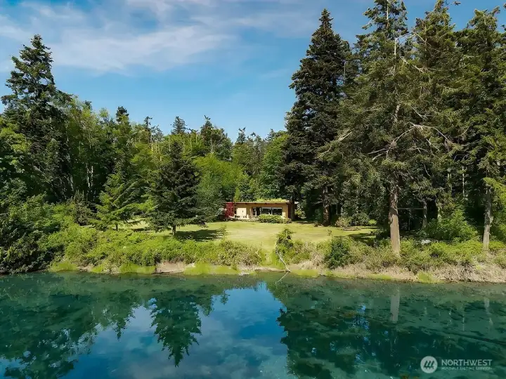 A rare 365 feet of no-bank waterfront awaits you with this park-like property. Easy access to try out a paddle board or kayak out to the big water at high tide.